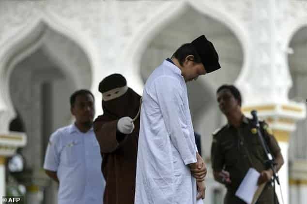 Indonesia's Aceh whips unmarried couples after hotel raid